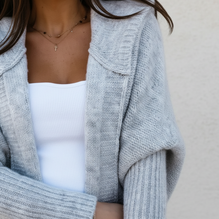 Stylish women's gray knitted gilet with hood, perfect for spring and autumn fashion