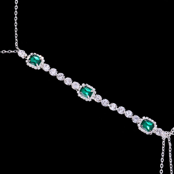 Stunning green crystal body chain necklace, a luxurious women's accessory. Perfect statement fashion jewelry.