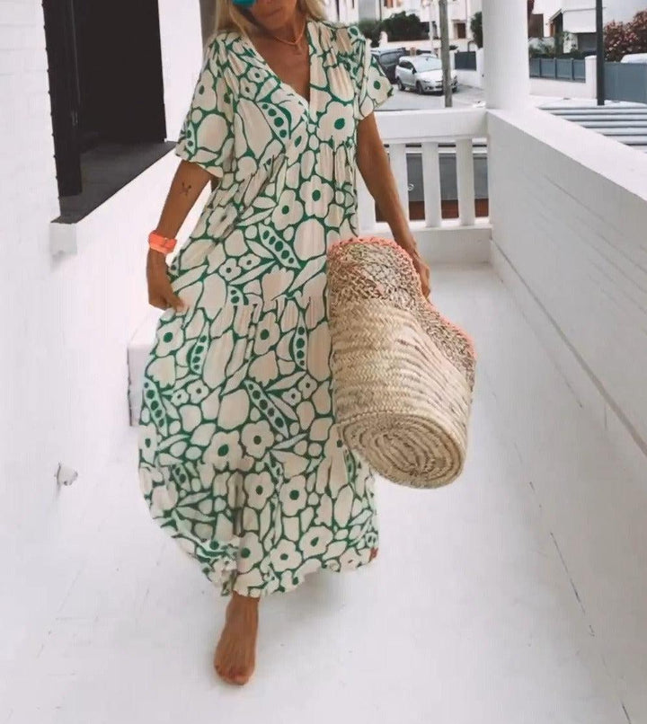 Elegant women's A-line green floral print maxi dress. Features short sleeves, V-neck, ideal for summer.