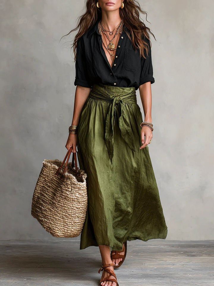 Women's green maxi skirt set with button-front top and tie-waist skirt, perfect for casual summer wear.