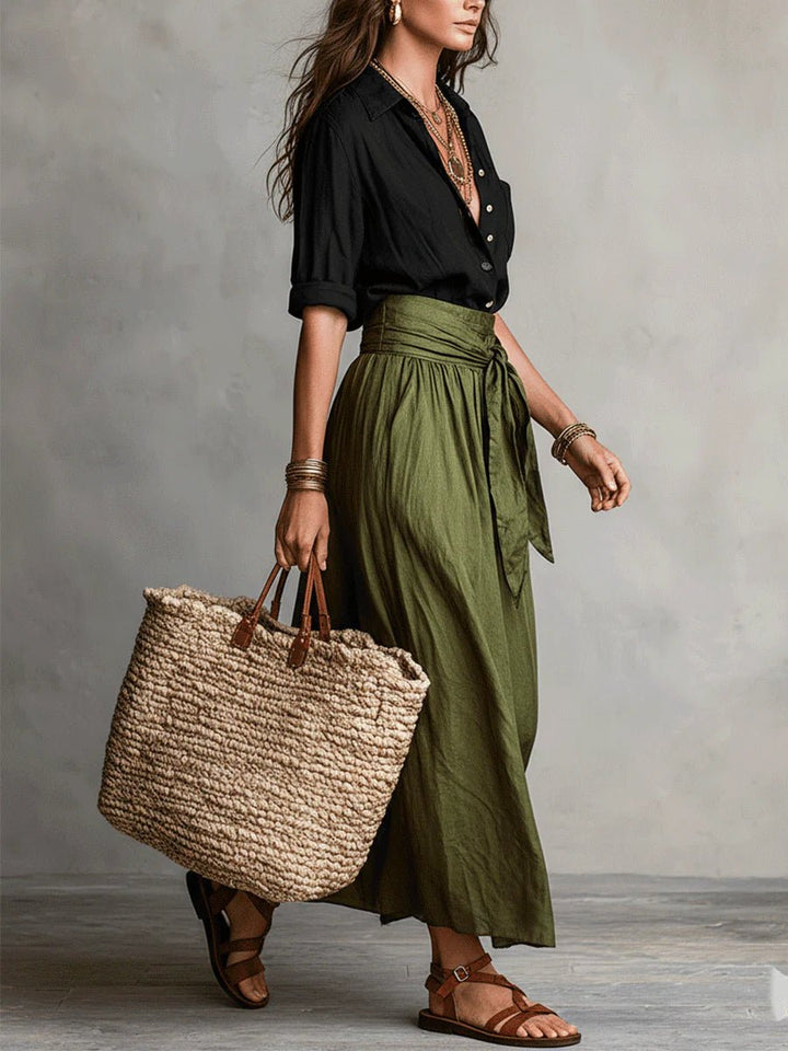 Relaxed fit women's two-piece green set featuring a button-front blouse and a stylish tie-waist maxi skirt.