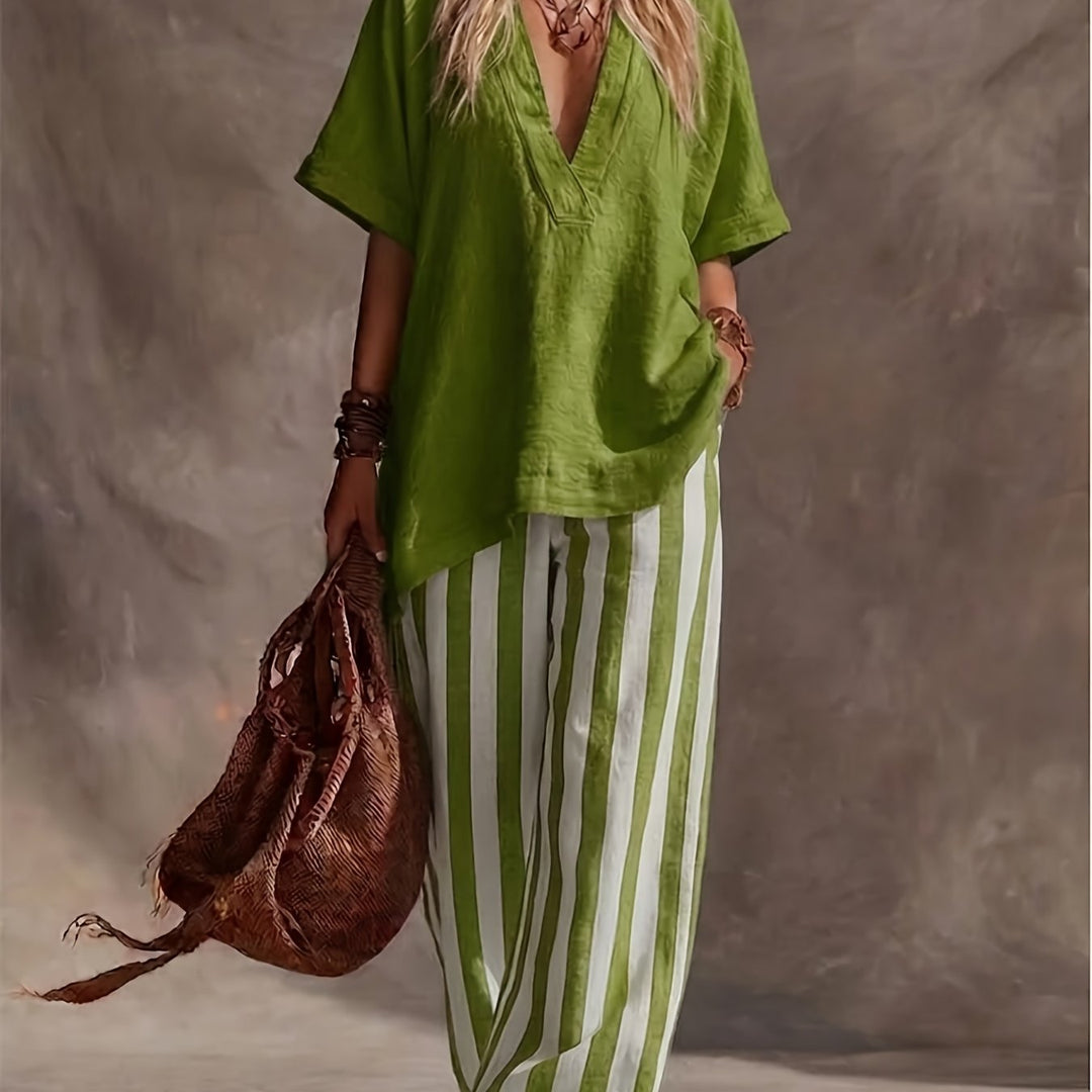 Fashionable women's green & yellow striped wide leg pants set with a V-neck short sleeve top for casual style.