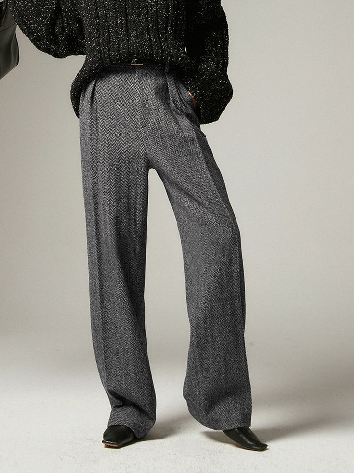 Stylish grey pleated wide-leg trousers for women, versatile for fashion or professional office wear. Comfortable & modern.