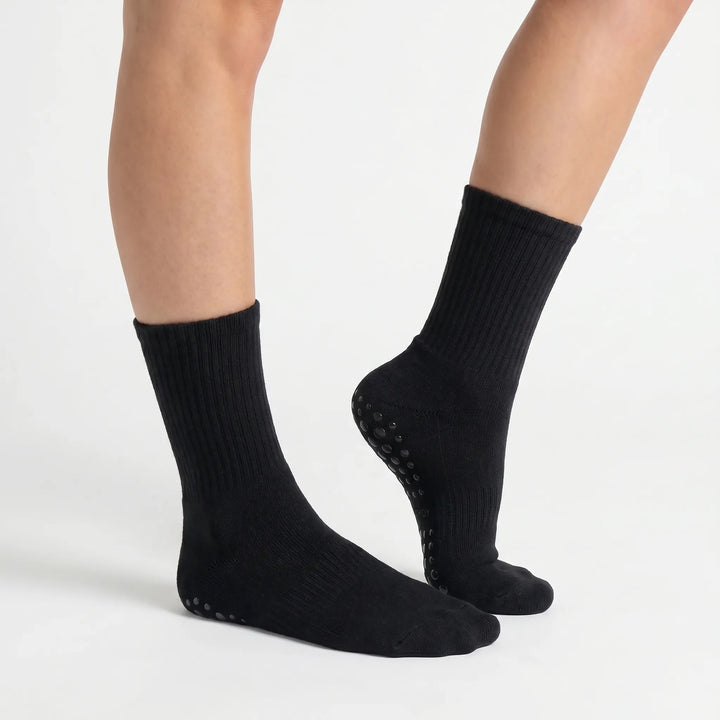 Durable women's grippy athletic crew socks for intense yoga, Pilates, and studio workouts.