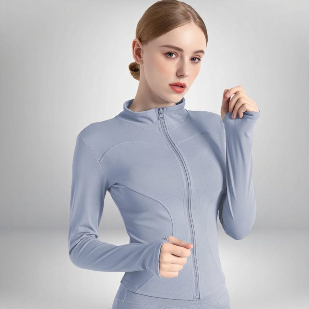 Full-body shot of a woman running in a Hailey breathable training jacket, ideal for active sportswear