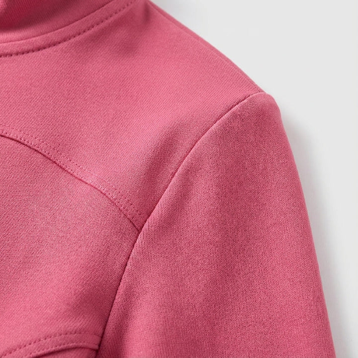 Close-up of breathable fabric on women's Hailey training jacket, showcasing stretch activewear