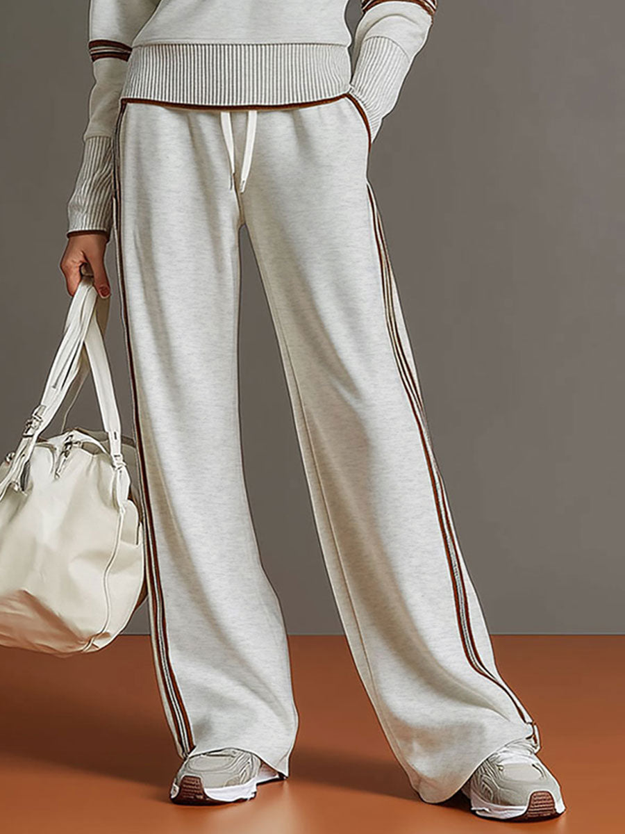 Soft fabric women's co-ord set, featuring a practical half-zip sweatshirt and stylish wide-leg trousers.