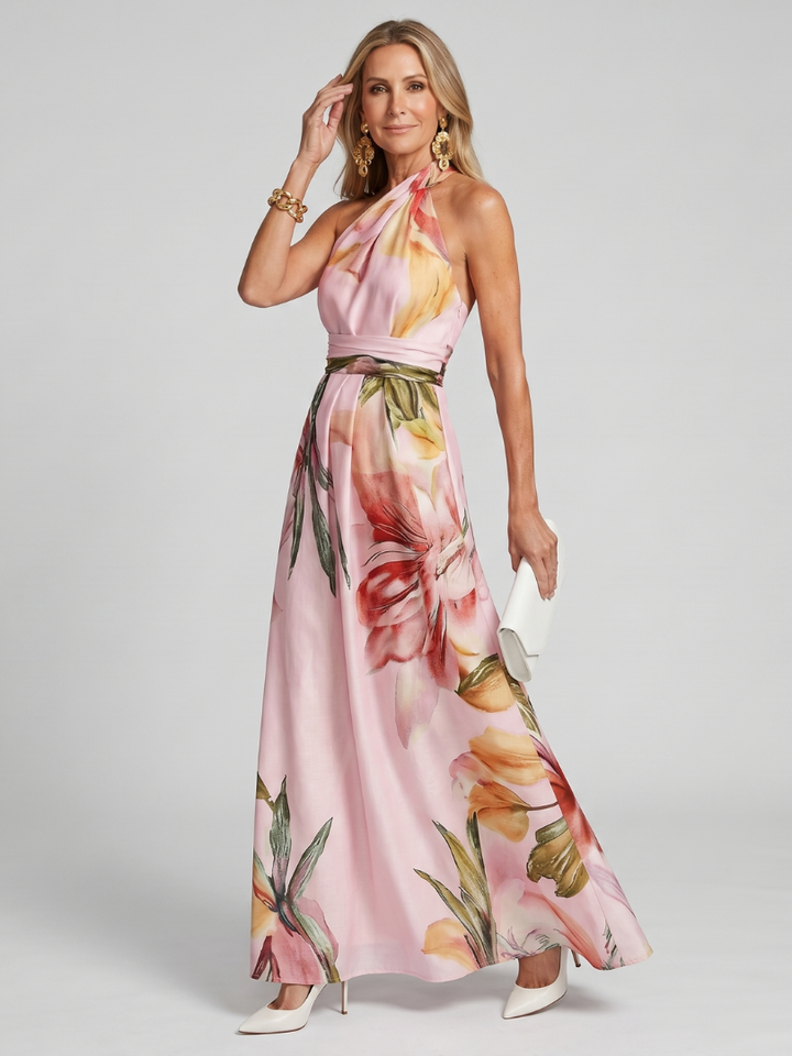Model wearing a stylish white halter maxi dress with a flowing skirt, perfect for summer days.