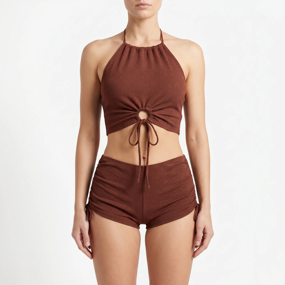 Black textured halter tankini top paired with boyshort swim bottoms, a stylish & adjustable women's swimwear set.