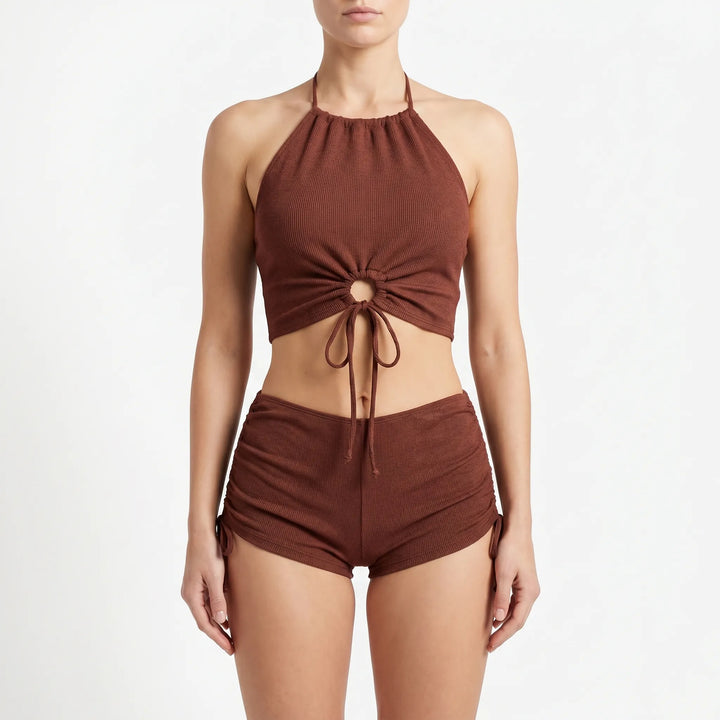 Black textured halter tankini top paired with boyshort swim bottoms, a stylish & adjustable women's swimwear set.