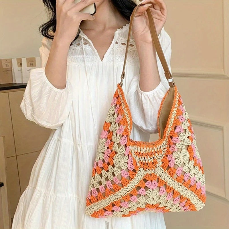 Women's hand-crocheted boho tote bag with vibrant colors, perfect for summer fashion.