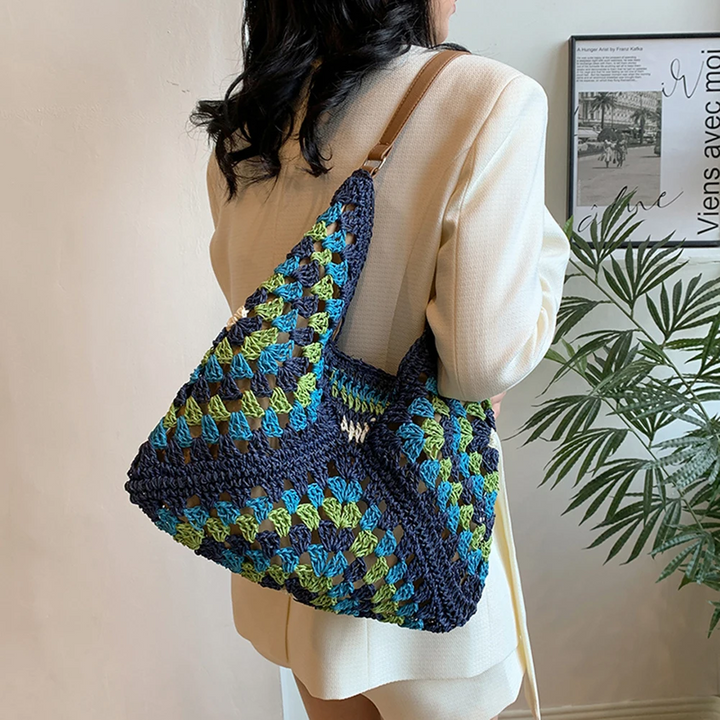 Casual women's boho tote bag, hand-crocheted with vibrant patterns, a stylish shoulder bag.