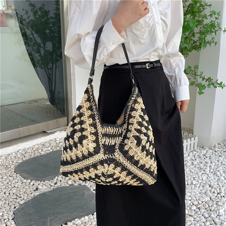 Women's vibrant boho shoulder bag, hand-crocheted and lightweight, perfect for summer.