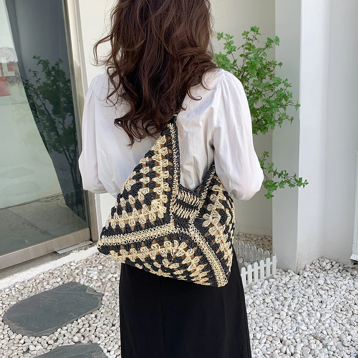 Stylish women's handcrafted tote, boho crochet design, a versatile casual accessory.