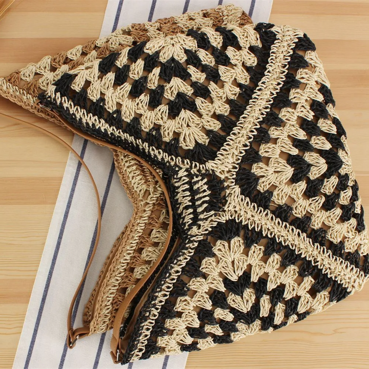 Women's hand-crocheted tote bag, vibrant boho style, excellent for summer fashion.