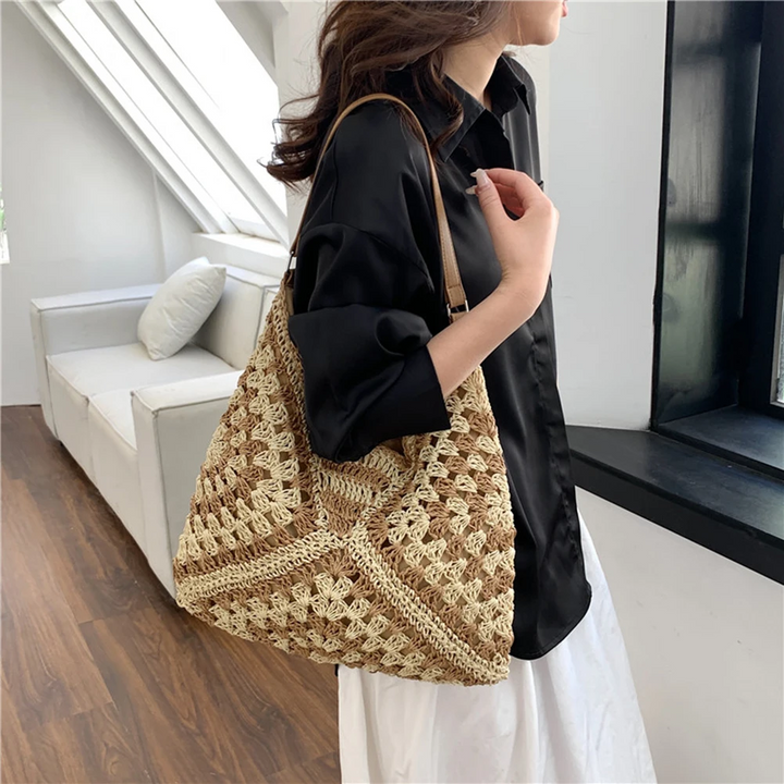Casual women's shoulder bag, hand-crocheted with a vibrant boho pattern, lightweight.