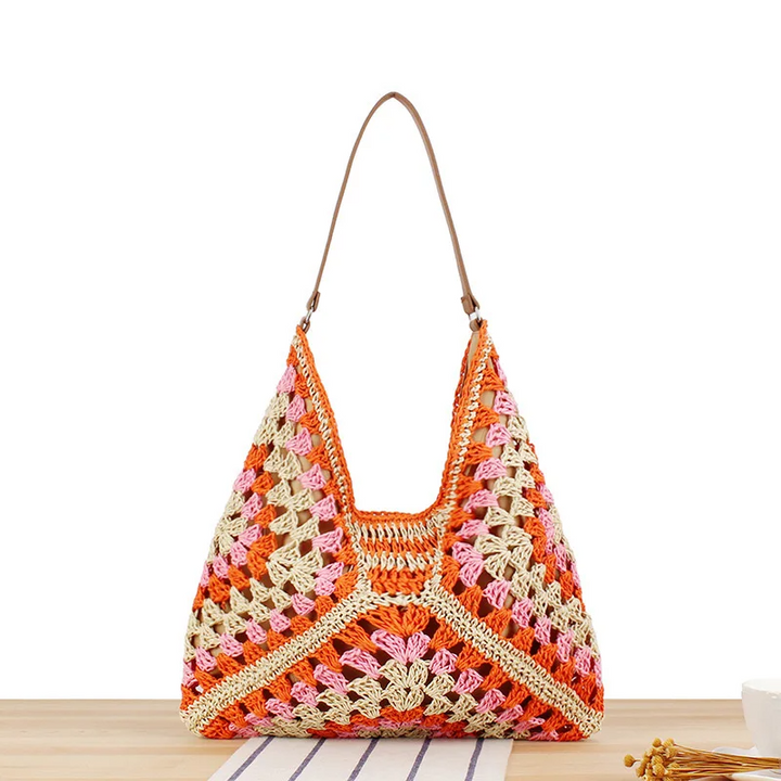 Handcrafted women's boho shoulder bag, crochet design, ideal for everyday summer use.