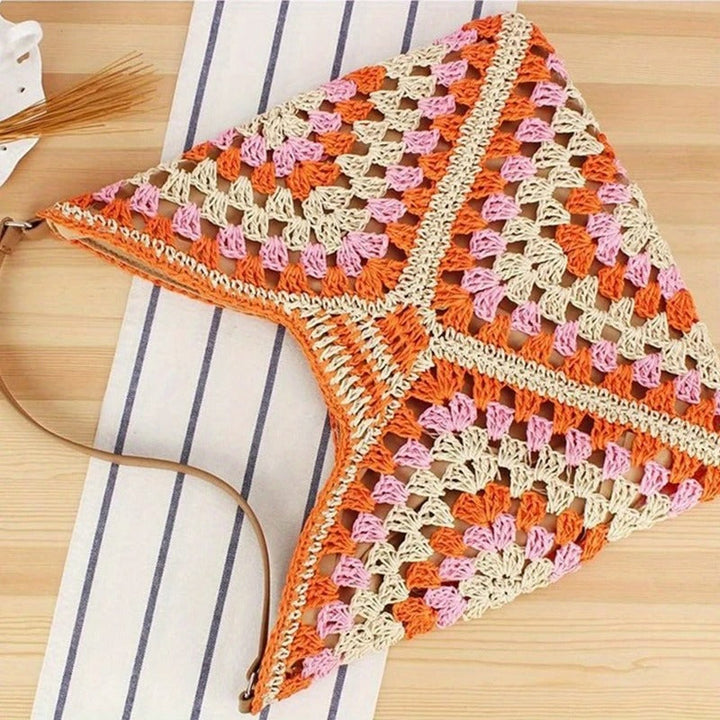 Handcrafted women's boho tote bag, crochet design, ideal for casual summer fashion.