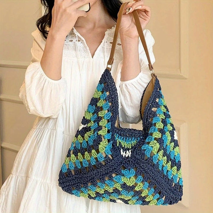 Women's vibrant crochet shoulder bag, boho style, lightweight & packable summer accessory.