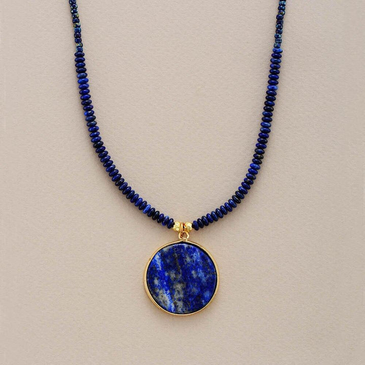 Women's handcrafted round lapis lazuli gemstone pendant necklace, ideal for spiritual jewelry.