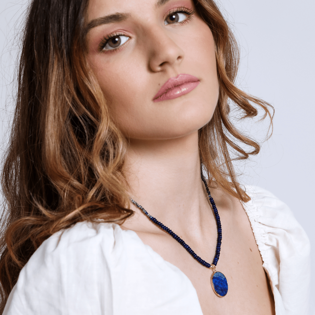 Vibrant blue lapis lazuli round pendant necklace for women, a beautiful healing stone and spiritual gift.