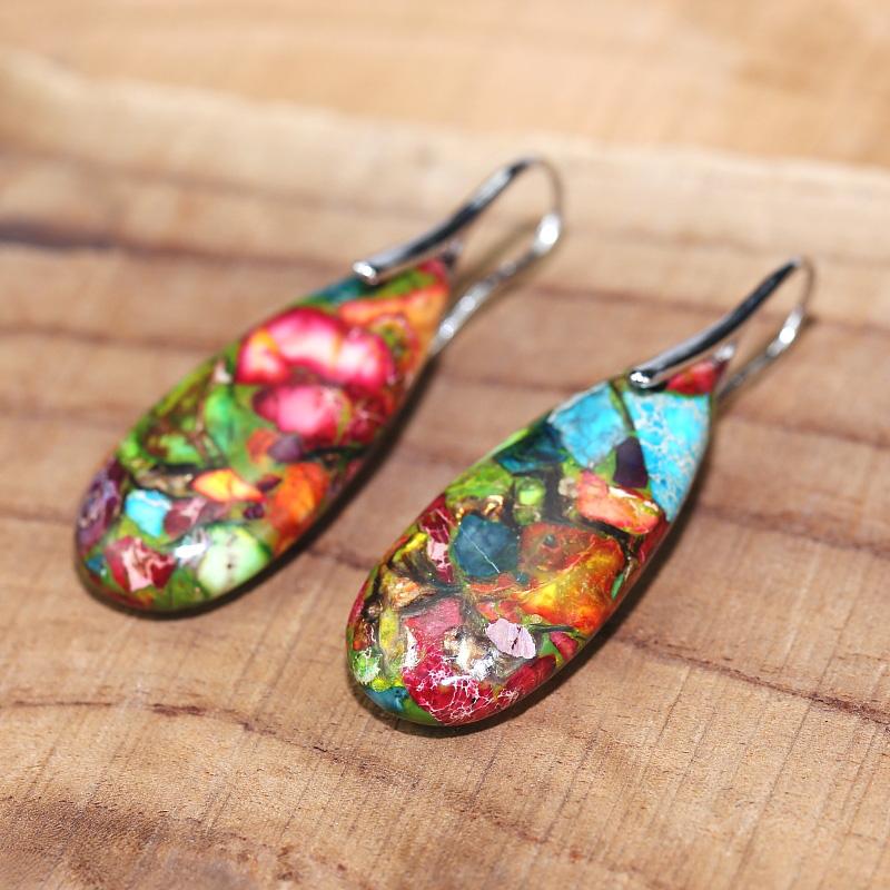 Close-up of spiritual jasper drop earrings for women. Beautiful handcrafted gemstone jewelry promoting balance.