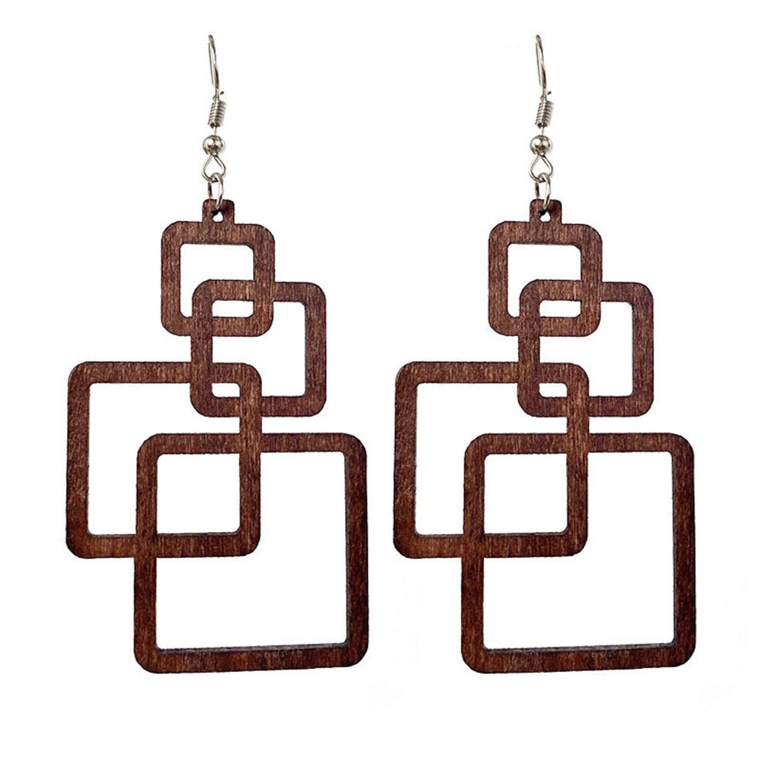 Women's handcrafted wooden drop earrings, eco-friendly & lightweight. Unique artisan fashion accessory.