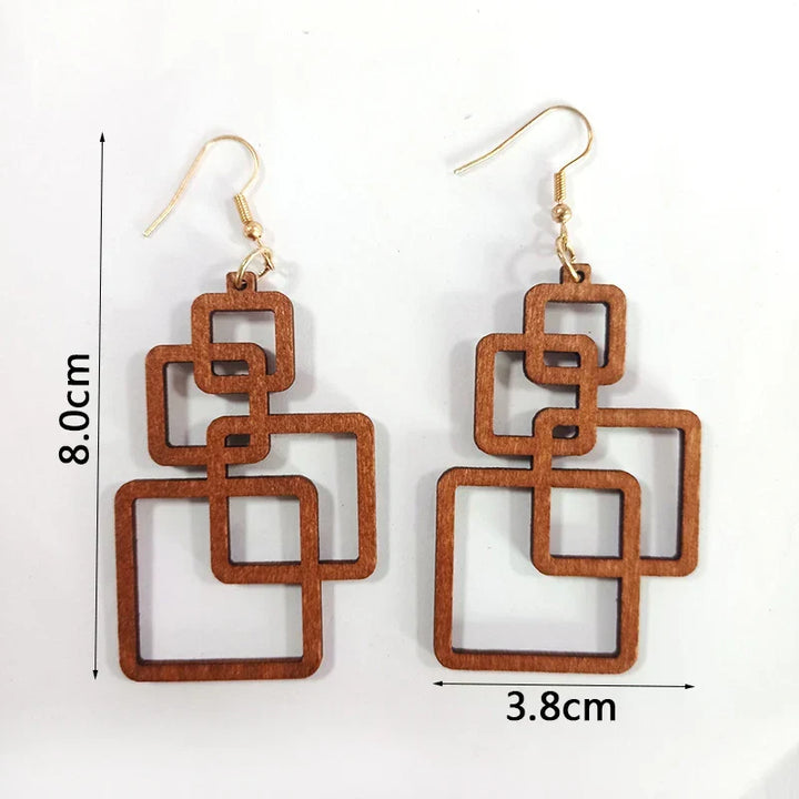 Elegant handcrafted wooden drop earrings for women. Eco-friendly artisan jewelry with a unique style.