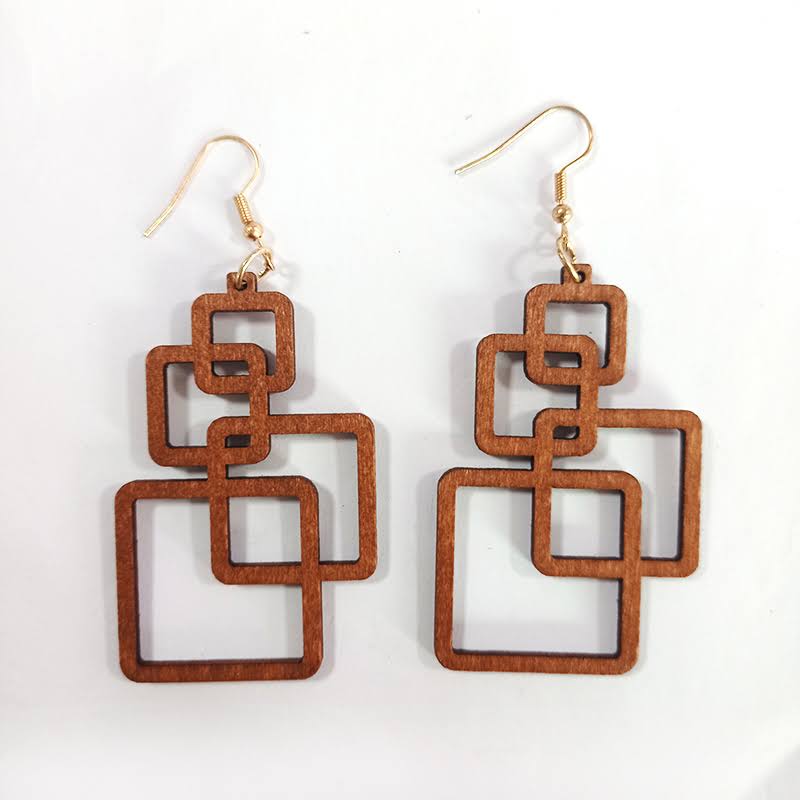 Stylish women's eco-friendly wooden drop earrings. Handcrafted lightweight fashion accessory for unique style.
