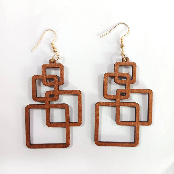 Stylish women's eco-friendly wooden drop earrings. Handcrafted lightweight fashion accessory for unique style.