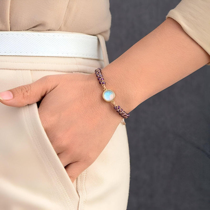 Close-up of a women's gemstone bracelet with amethyst and opal, ideal for healing and spiritual jewelry