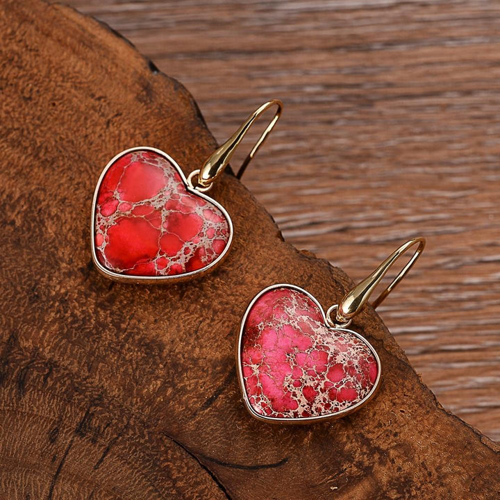 Stylish women's heart-cut Ruby Essence Jasper dangle earrings. Natural red gemstone, unique artisan jewelry gift.