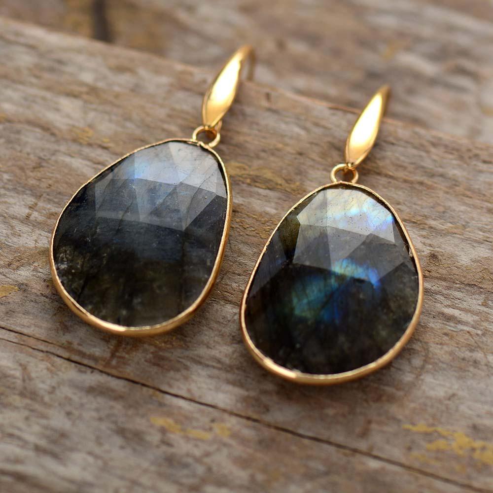 Close-up of women's labradorite dreamy crystal earrings, showcasing iridescent gemstone and handcrafted detail.