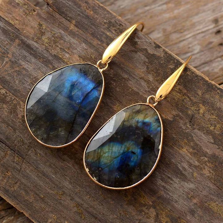 Iridescent labradorite crystal earrings for women. Handmade spiritual jewelry, a unique bohemian fashion accessory.