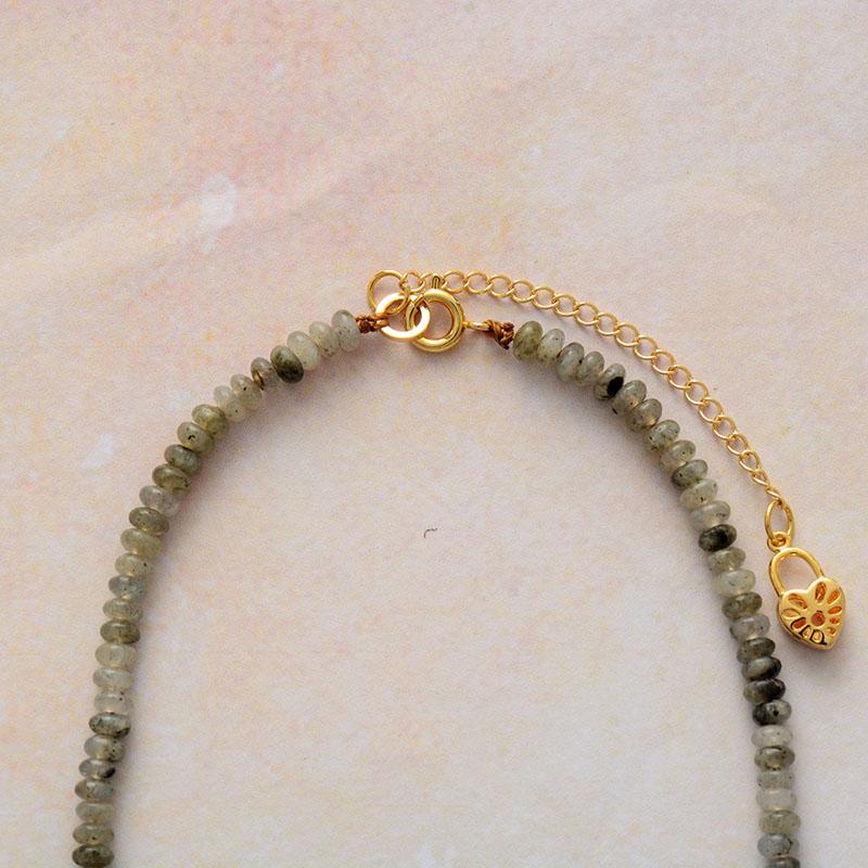 Close-up of women's Jasper & Labradorite beaded necklace. Detailed gemstone heart jewelry with healing energy.