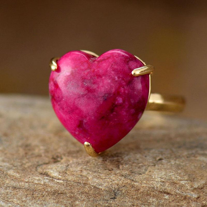 Women's adjustable healing heart ring with natural gemstones like apatite, labradorite, and jade.