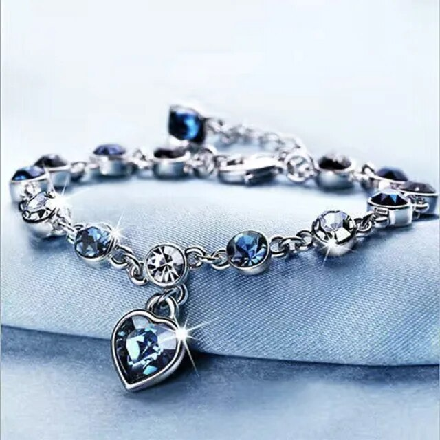 Women's Heart of the Ocean crystal bracelet, ocean-inspired, sparkling blue heart gem, elegant jewelry.
