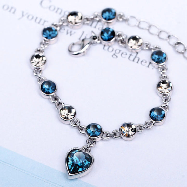 Elegant women's adjustable Heart of the Ocean crystal bracelet, sparkling blue heart, perfect gift for her.