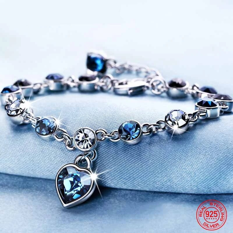 Women's Heart of the Ocean crystal bracelet, blue heart-shaped sparkling crystal, adjustable silver chain.