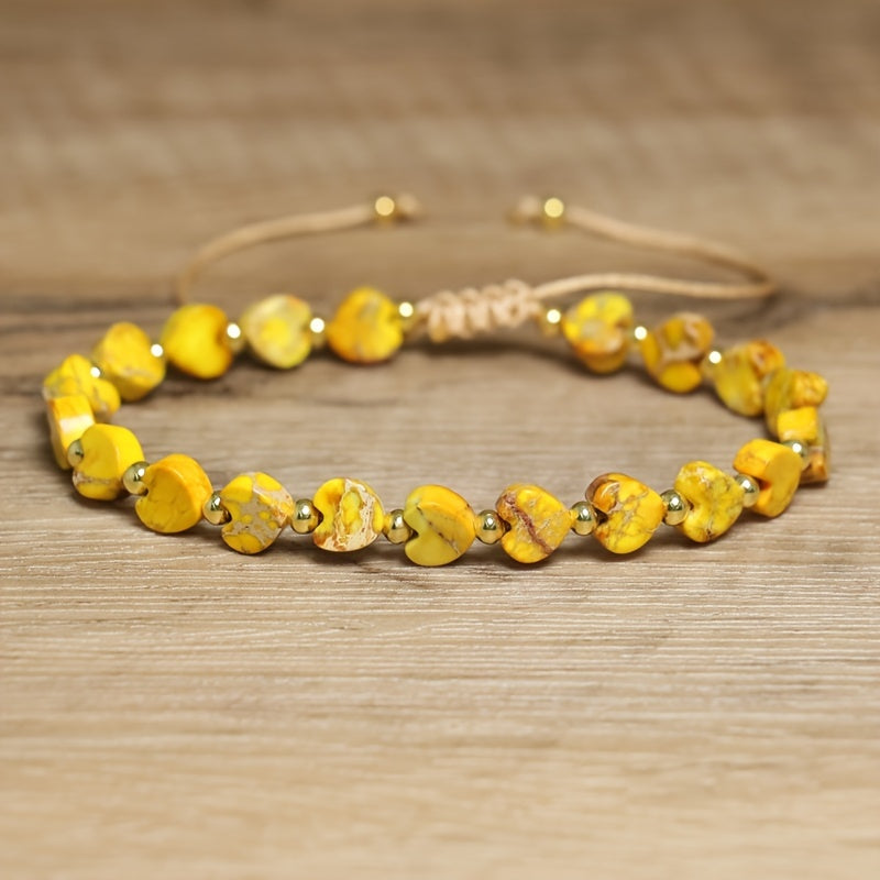 Women's heart-shaped gemstone bead bracelet with natural stones and elegant gold accents.