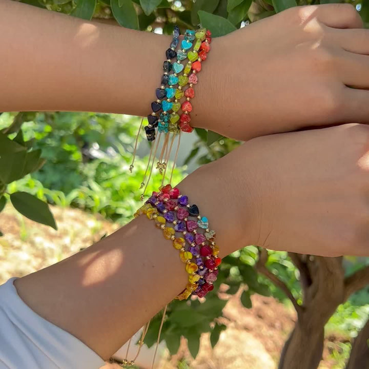 Stackable women's heart gemstone bracelet with colorful natural stone beads and gold accents.