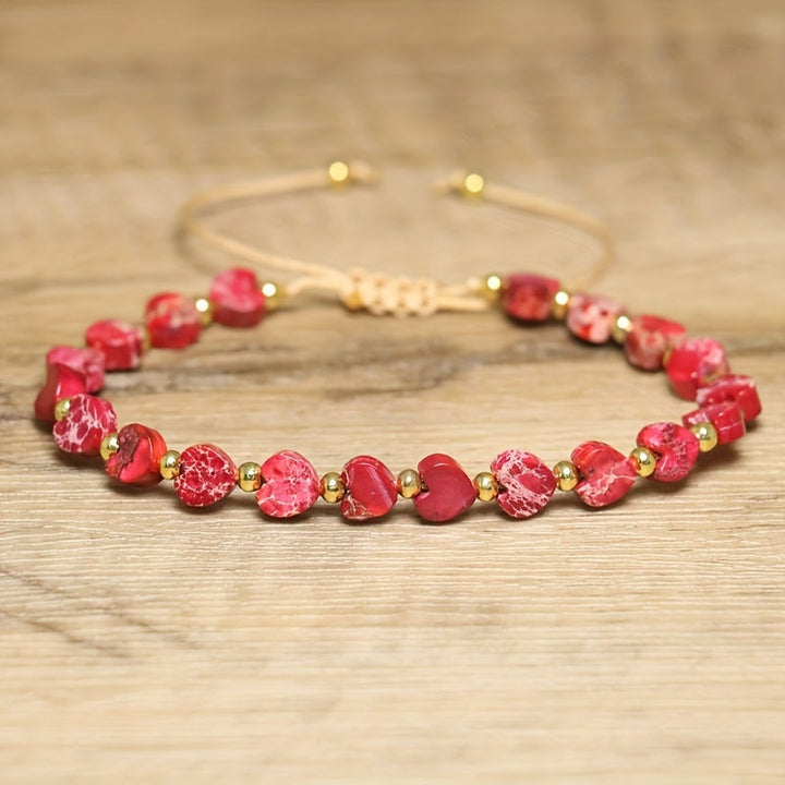 Close-up of a vibrant heart gemstone bead bracelet for women, natural stones & gold accent.