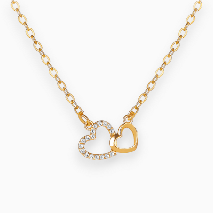 Elegant women's connection pendant necklace, representing eternal love. Silver heart jewelry, a symbolic meaningful accessory.