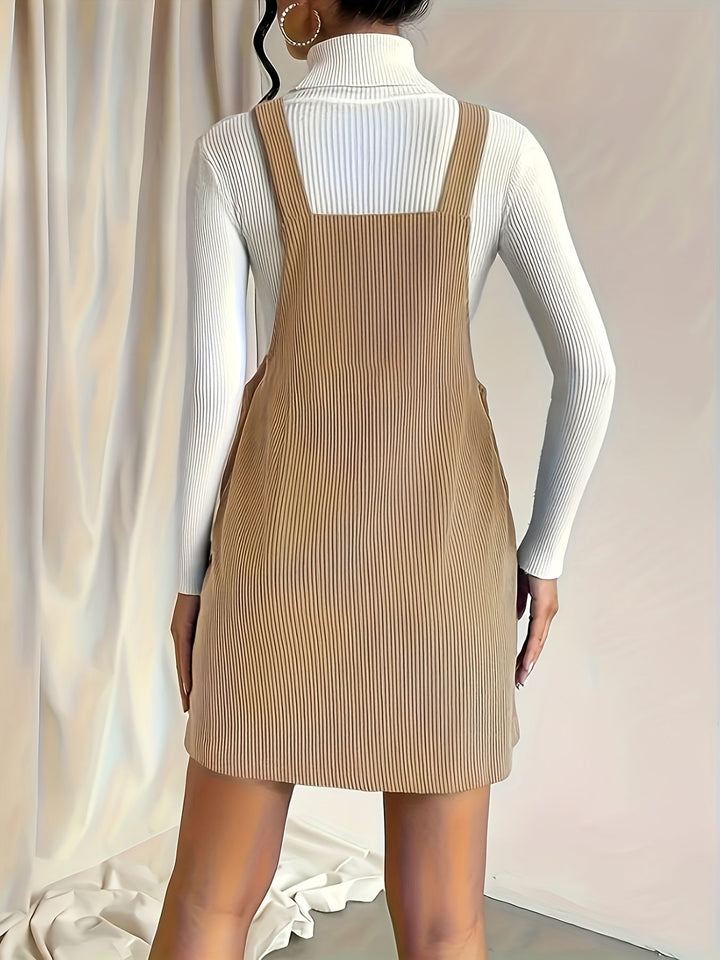 Olive green women's jumper dress, relaxed fit, versatile for casual or layered autumn/winter looks.
