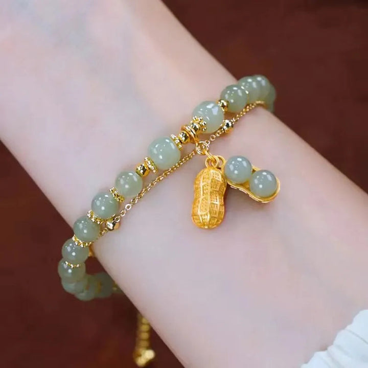 Women's Hetian Jade bracelet with a shimmering gold accent, an elegant and timeless gemstone accessory.