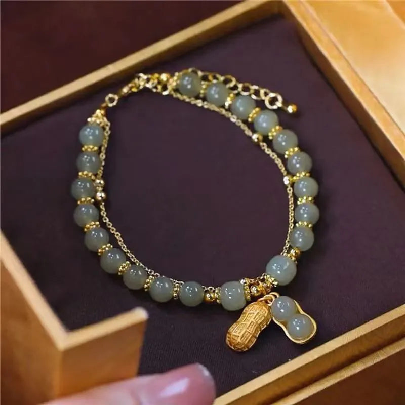 Adjustable Hetian Jade bracelet for women, featuring a striking gold accent. A timeless and elegant gemstone accessory.