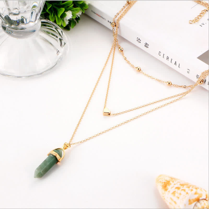Close-up of Hexagon Gemstone Necklace, Aurora crystal glow. Women's spiritual jewelry.