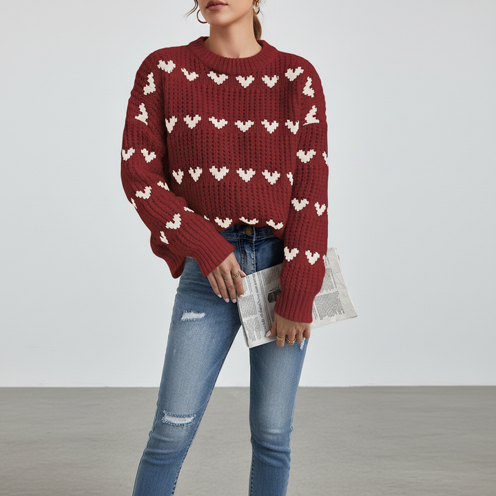 Casual women's high collar pullover, pink with white heart design, perfect for cozy winter wear