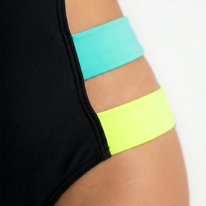 Neon accented high-cut monokini. Women's cutout one-piece swimsuit, a trendy choice for poolside style and beach.