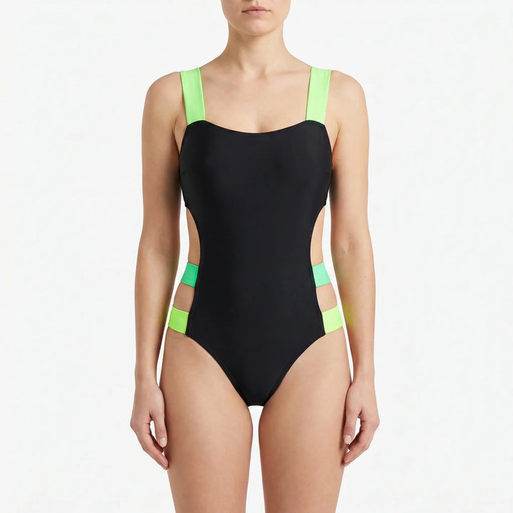 Trendy women's monokini swimwear with high-cut & cutout details, highlighted by bold neon accents for summer fashion.